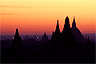 Sunrise colors Bagan's silhouettes in stillness