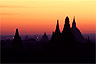 Sunrise colors Bagan's silhouettes in stillness