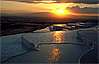 Evening sun reflects in travertine pools at Pamukkale, Turkey